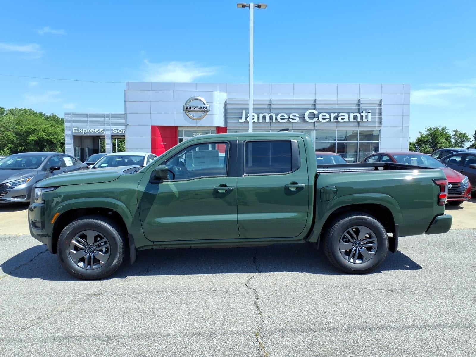 2026 Nissan Frontier Crew Cab SV in Tactical Green Metallic Daq — front three-quarter view