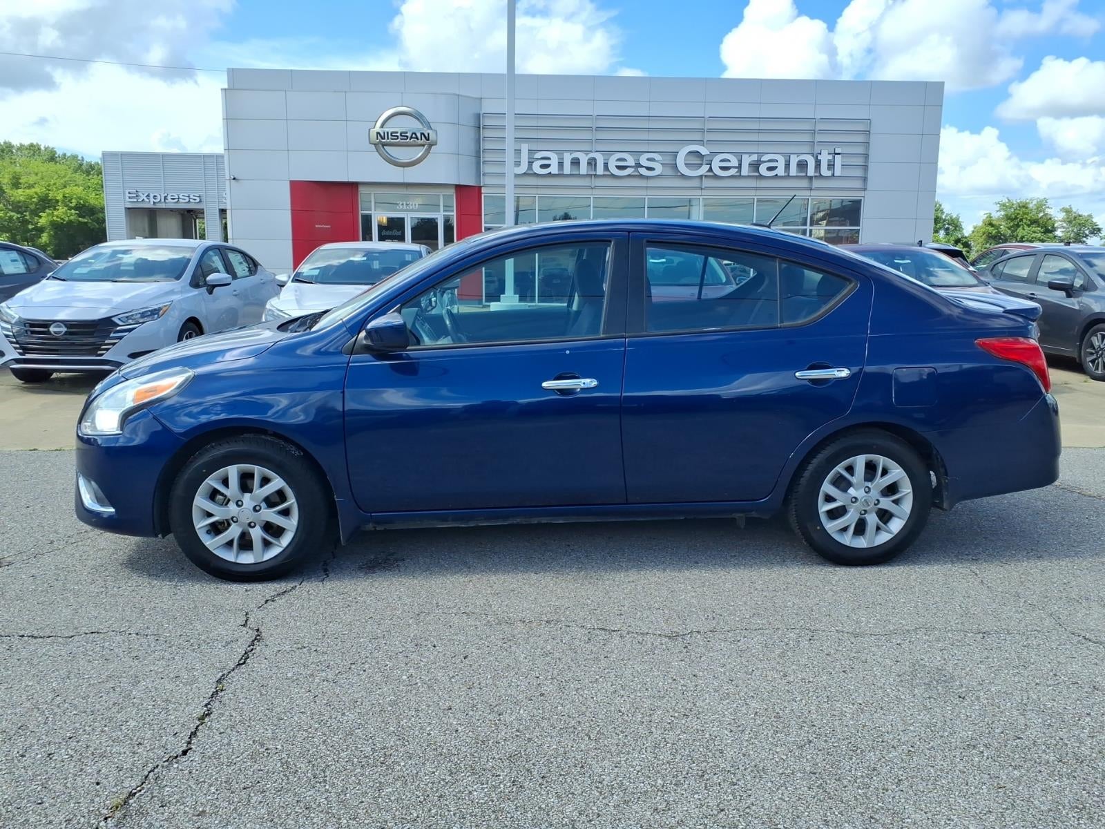 2019 Nissan Versa SV in Deep Blue Pearl Ray — front three-quarter view