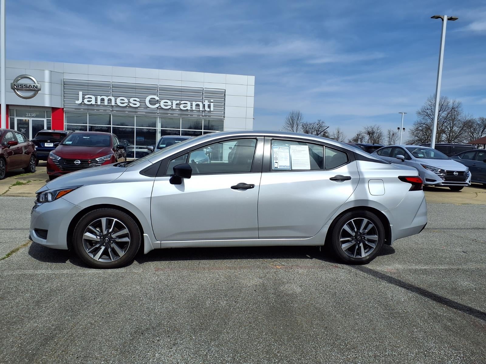 2023 Nissan Versa S in Silver — front three-quarter view