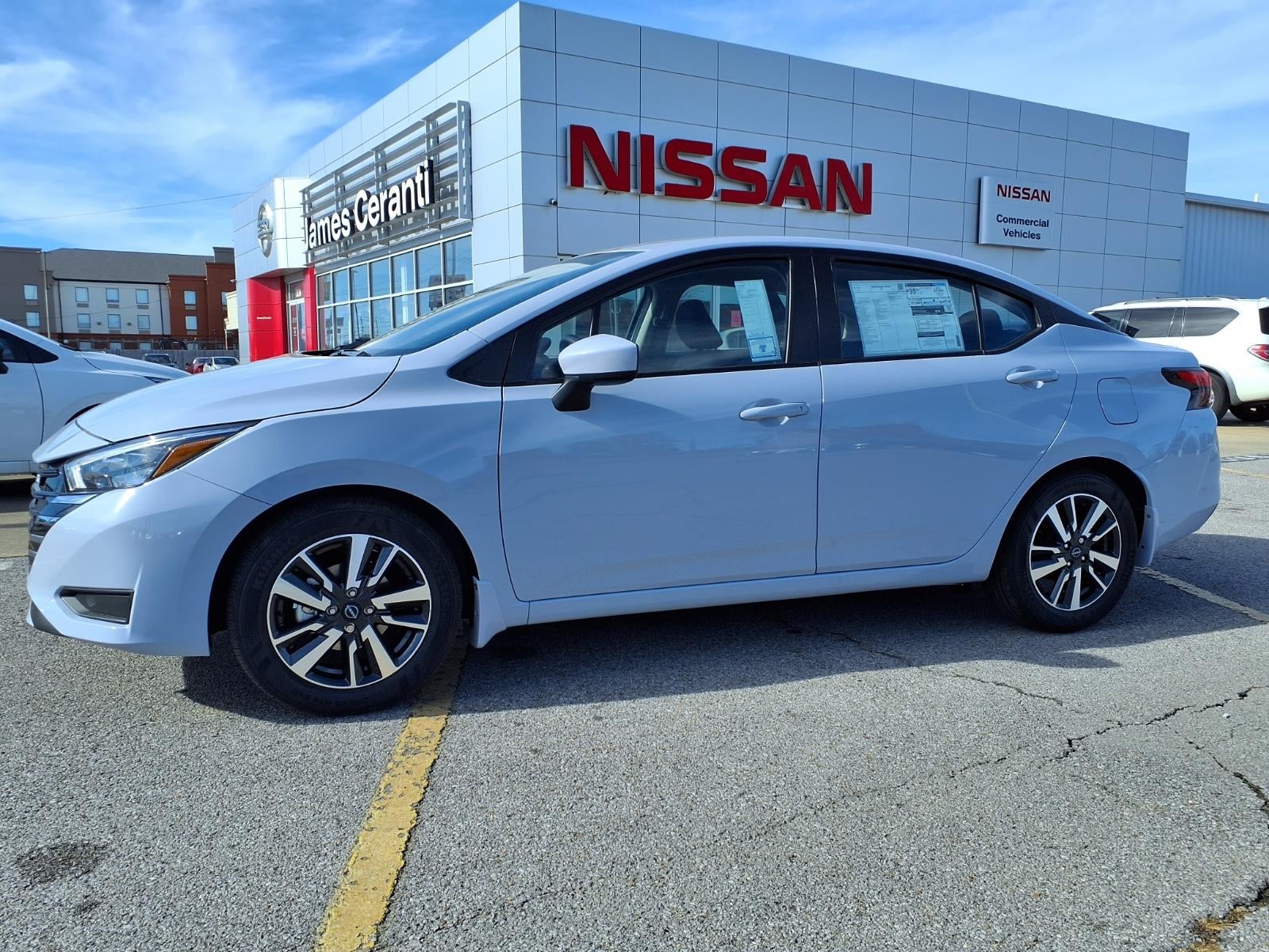 2025 Nissan Versa SV in Gray Sky Pearl Kch — front three-quarter view