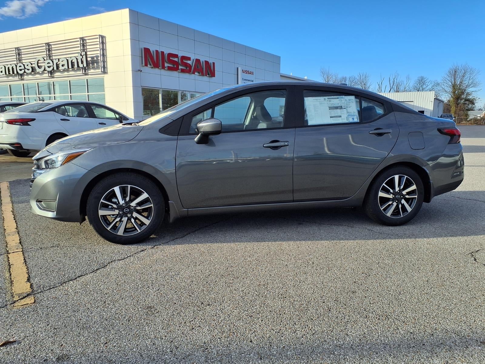 2025 Nissan Versa SV in Gun Metallic Kad — front three-quarter view