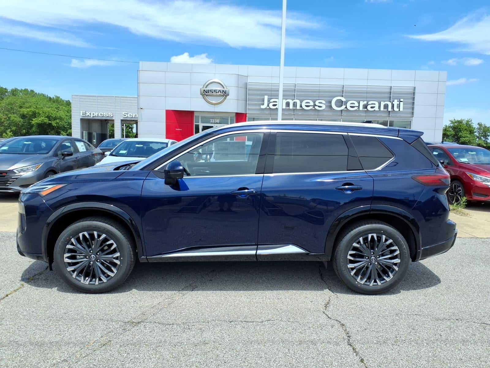 2026 Nissan Rogue Platinum in Deep Ocean Blue Pearl Rcj — front three-quarter view